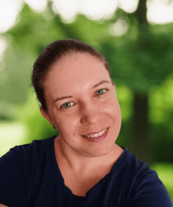 Kata Penzes - Organised Virtual Assistant with blurry green background